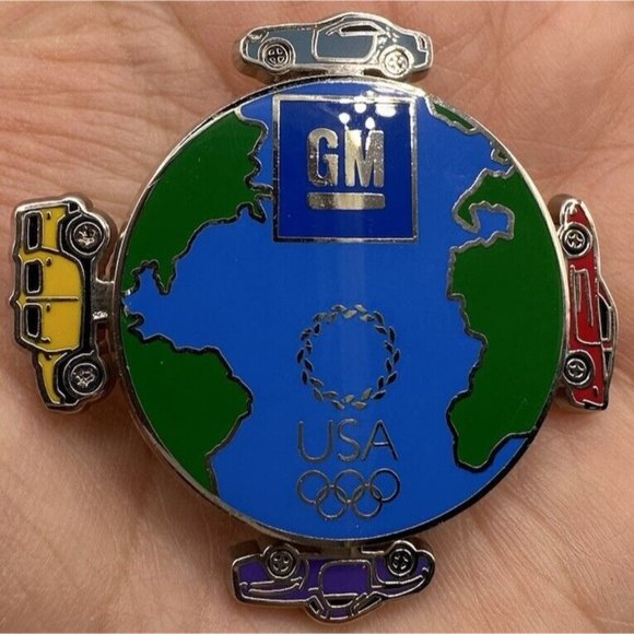 ATHENS 2004 OLYMPICS PIN GM GENERAL MOTORS Souvenir Pin MOVING CARS‎ - Picture 1 of 4